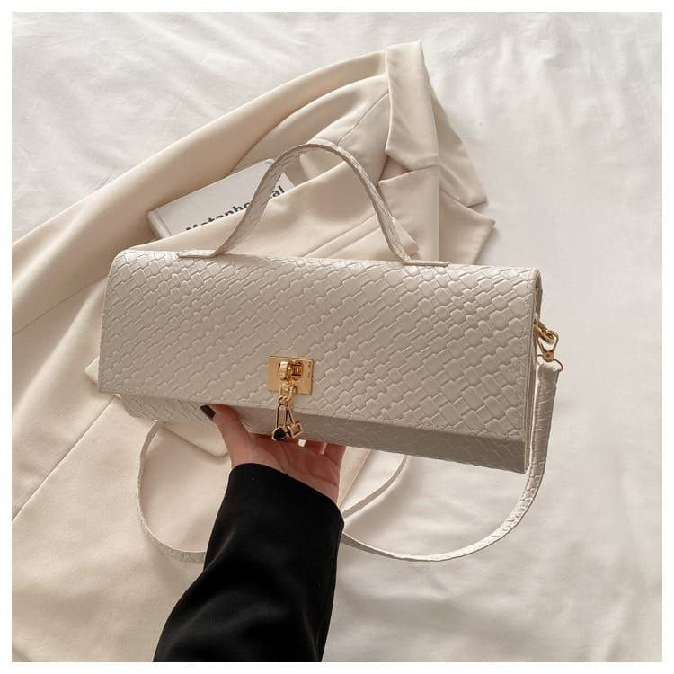 Bottega Veneta Triangle Bag – Bold Geometry, Iconic Luxury
